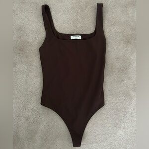 Babaton chocolate bodysuit. Medium